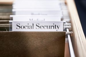 Social Security: Files and folders in desk drawer with labels and tabs